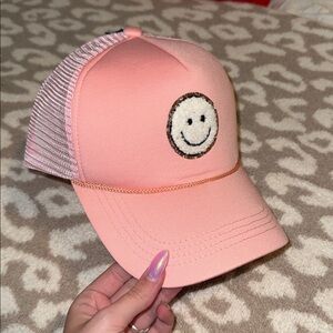pink smiley face trucker